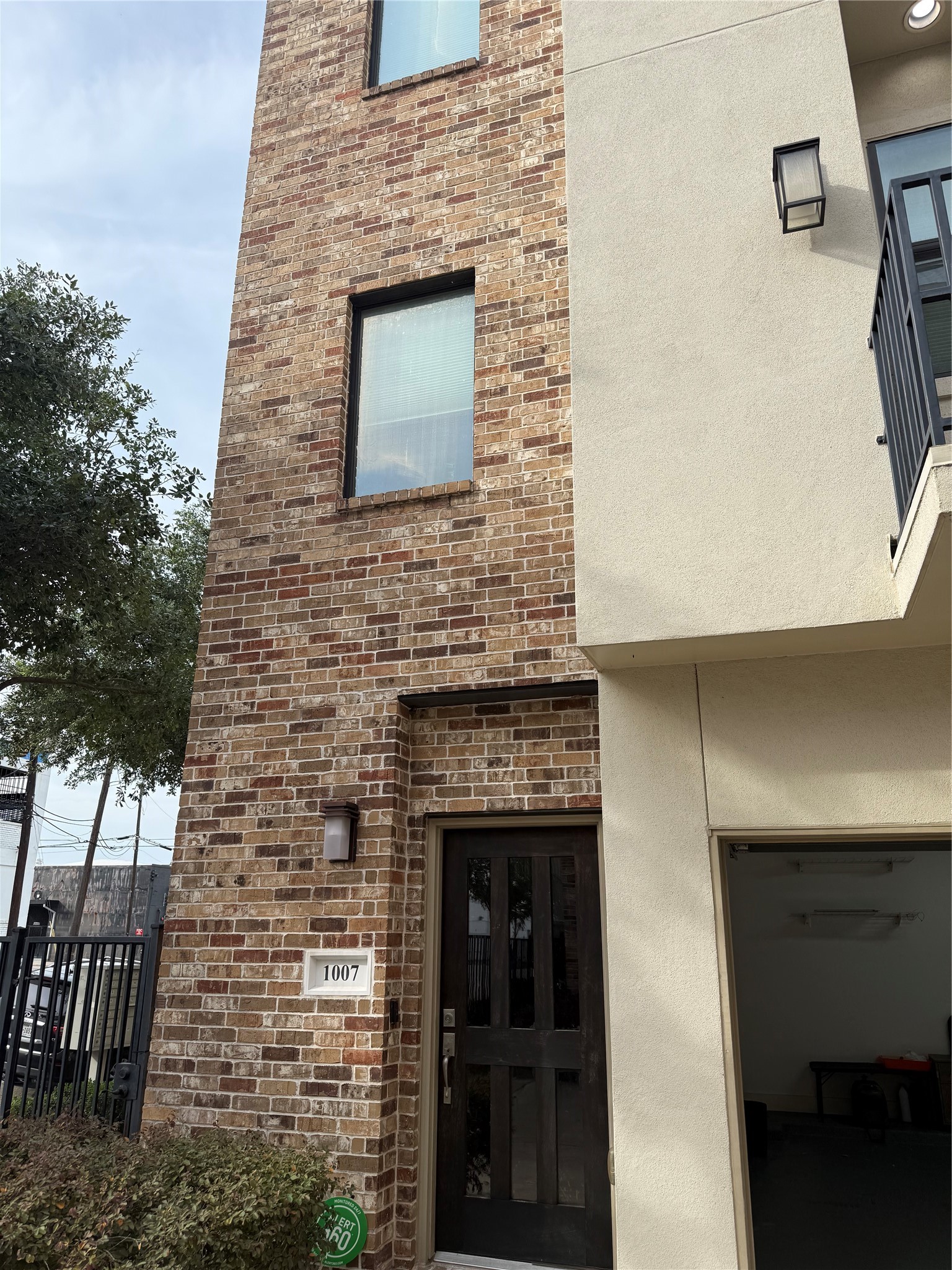 1007 Roberts Street Houston, TX 77003 - Photo 2 of 11 a stone house with a door and a yard