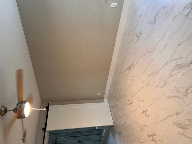 922 Gentry Drive Leander, TX 78641 - Photo 12 of 19 Unfurnished room featuring a barn door, light marble finish floors, and a ceiling fan