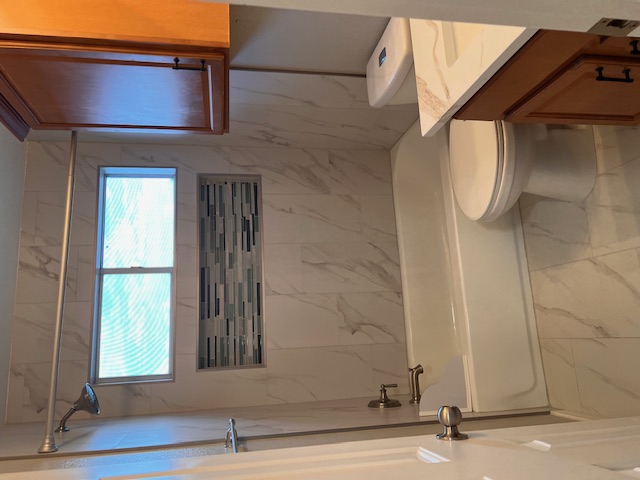 922 Gentry Drive Leander, TX 78641 - Photo 17 of 19 Full bathroom with bathtub / shower combination, marble finish floors, and vanity