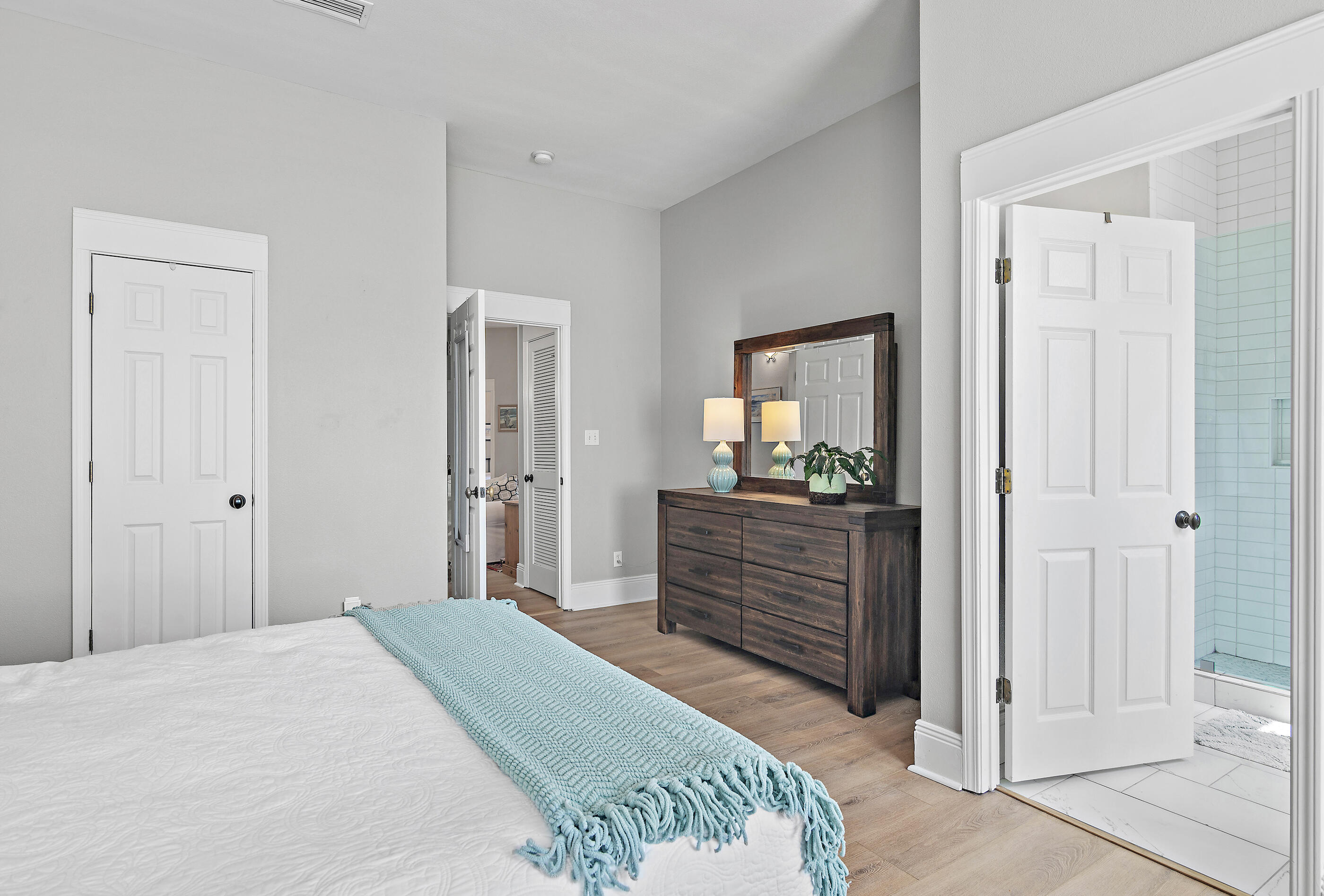 122 Shorebird Drive, Unit 814 Santa Rosa Beach, FL 32459 - Photo 11 of 25 a bedroom with a bed and a mirror