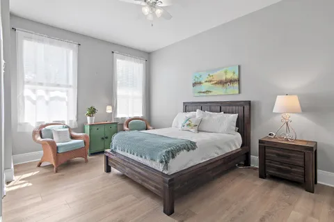 a bed room with a bed and a chair