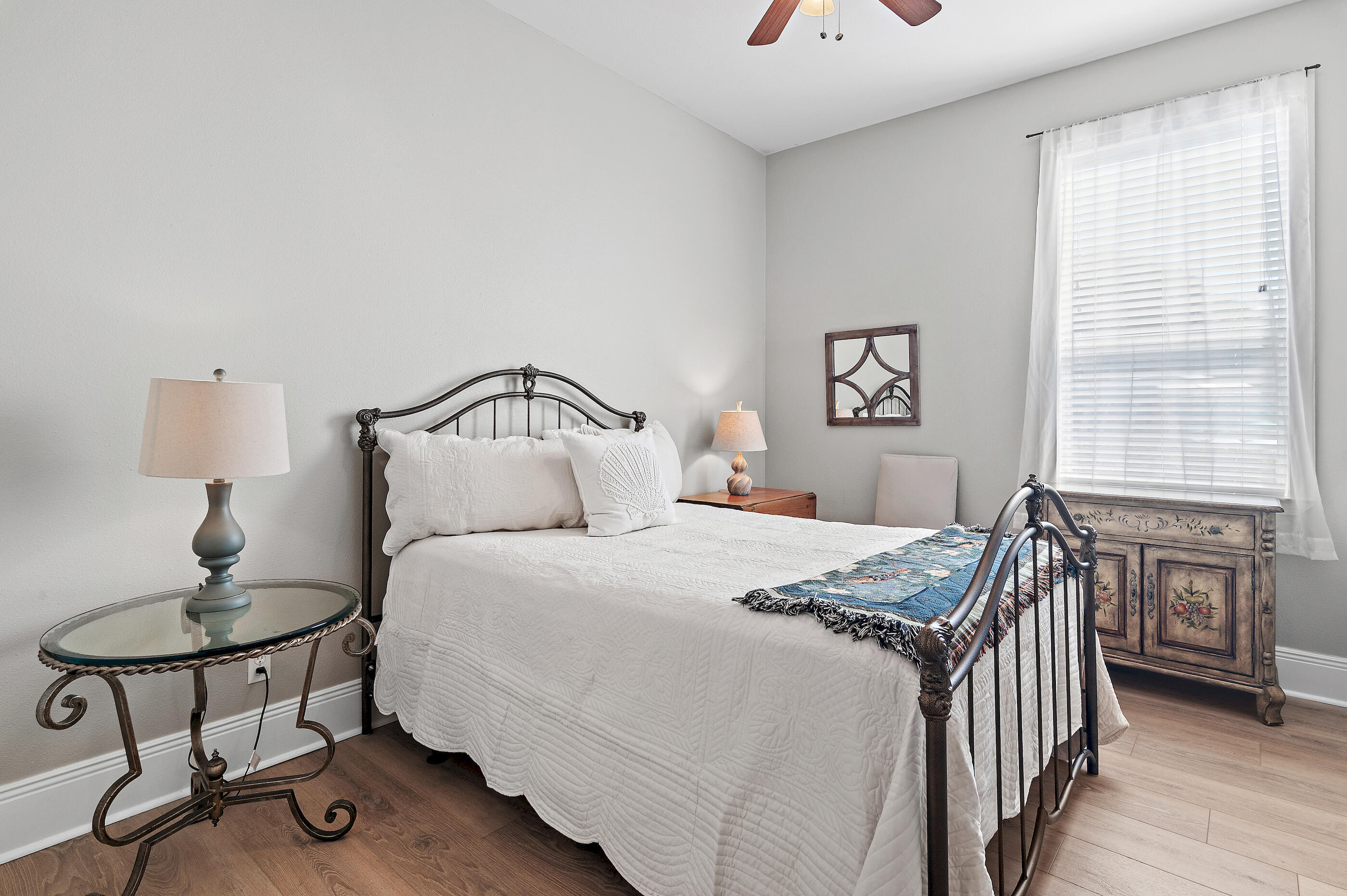 122 Shorebird Drive, Unit 814 Santa Rosa Beach, FL 32459 - Photo 15 of 25 a bedroom with a bed and a chandelier