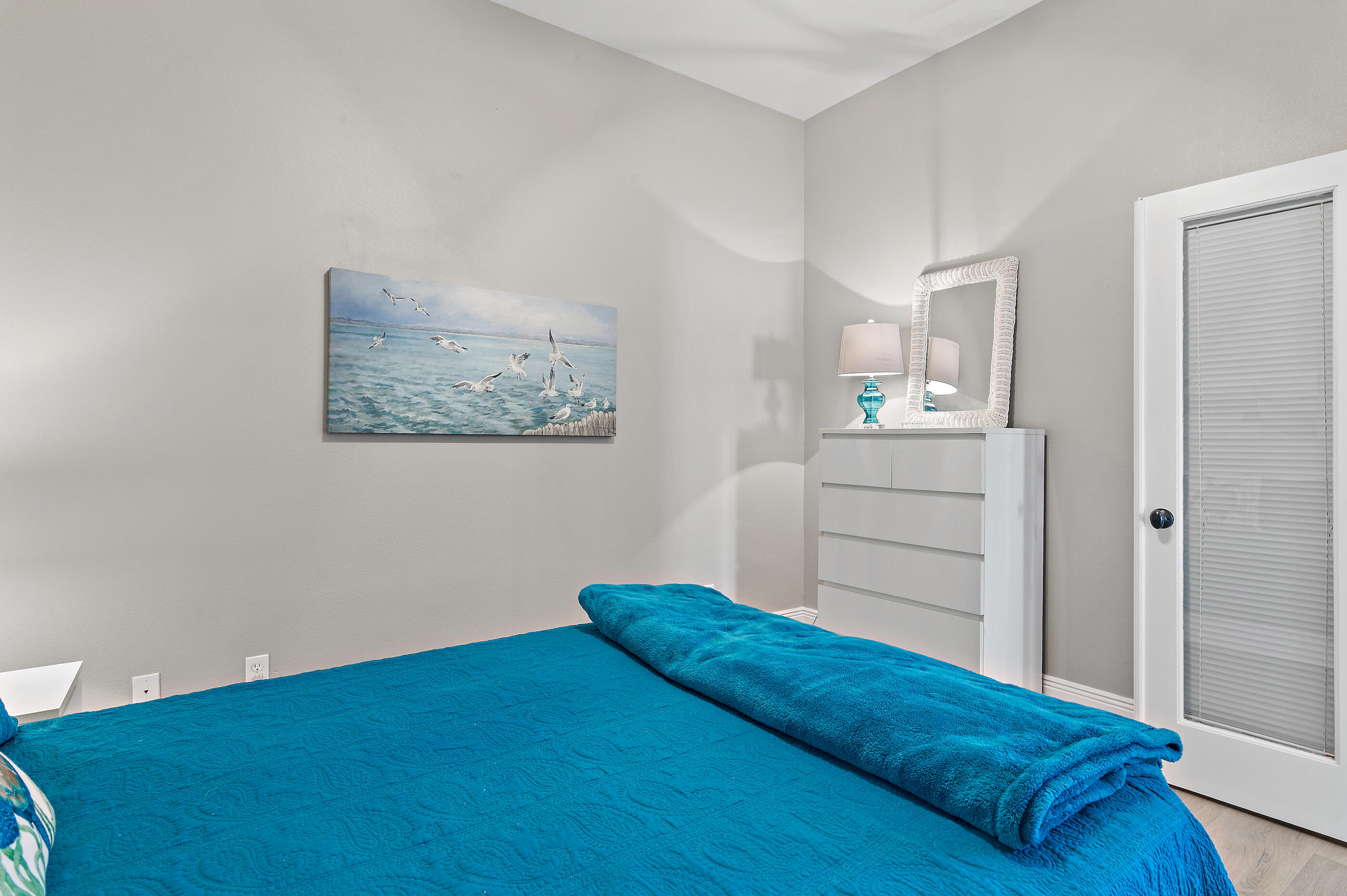 122 Shorebird Drive, Unit 814 Santa Rosa Beach, FL 32459 - Photo 17 of 25 a bedroom with a bed and cabinet