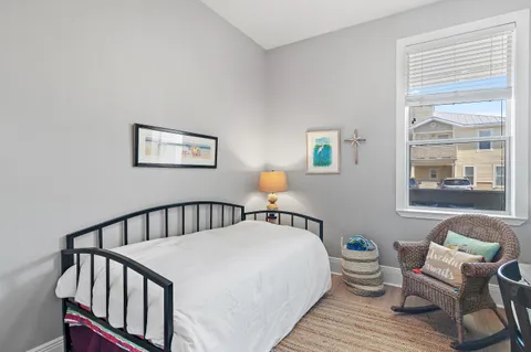 a bedroom with furniture and a window