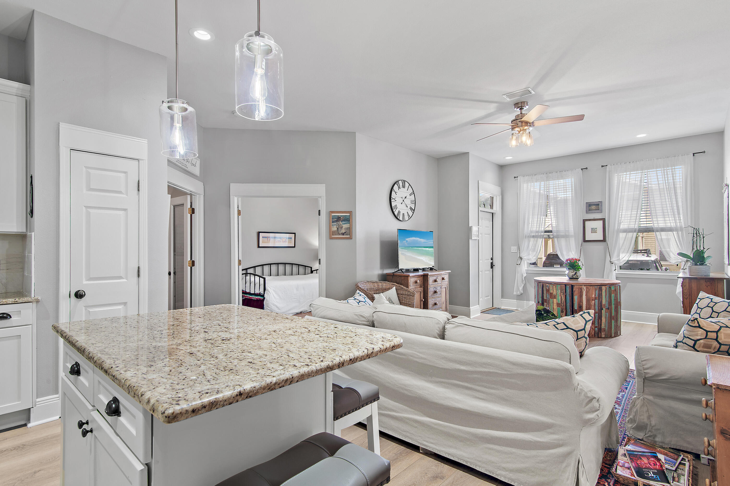 122 Shorebird Drive, Unit 814 Santa Rosa Beach, FL 32459 - Photo 6 of 25 a living room with kitchen island furniture and a chandelier