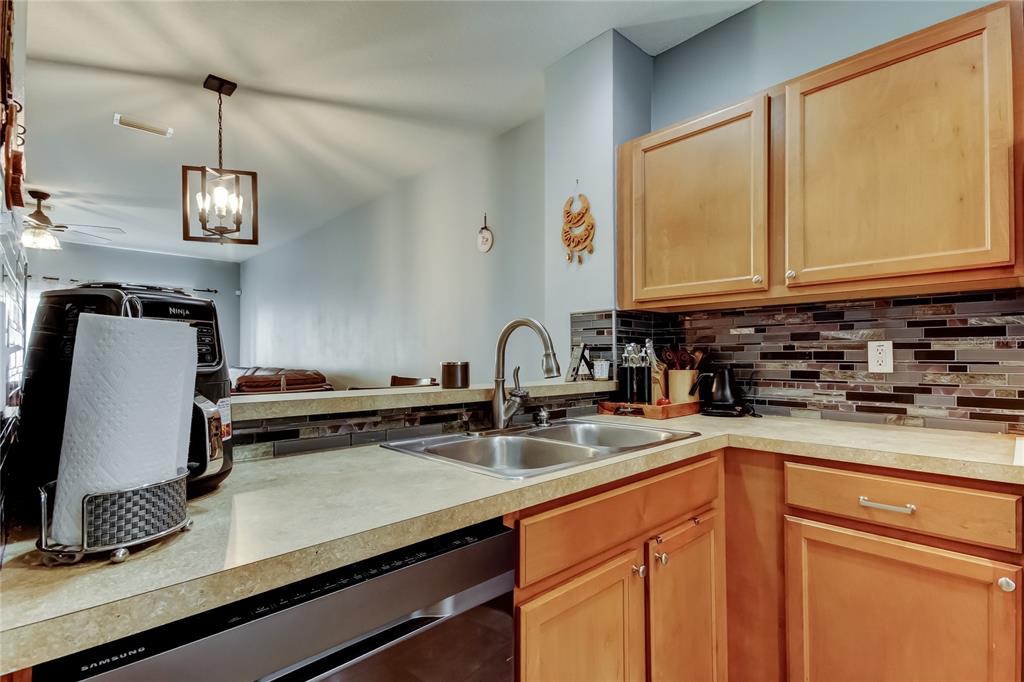 8504 Gablebend Way Tampa, FL 33647 - Photo 16 of 34 a kitchen with a sink cabinets and window