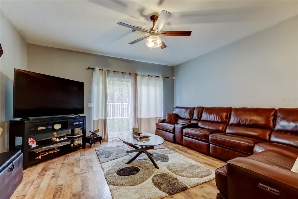 8504 Gablebend Way Tampa, FL 33647 - Photo 5 of 34 a living room with furniture and a flat screen tv