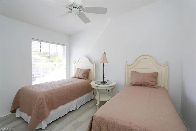 a bedroom with bed and a window