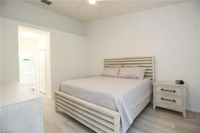 a bedroom with a bed and a tv