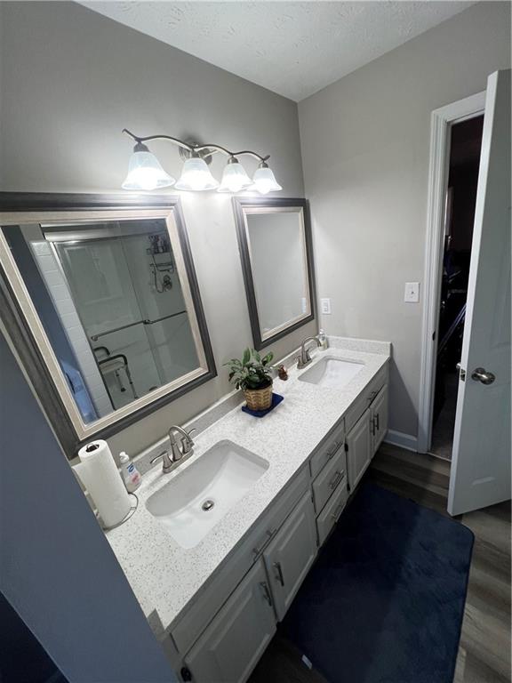 3735 Warwick Way Snellville, GA 30039 - Photo 14 of 28 a bathroom with a sink double vanity and a mirror