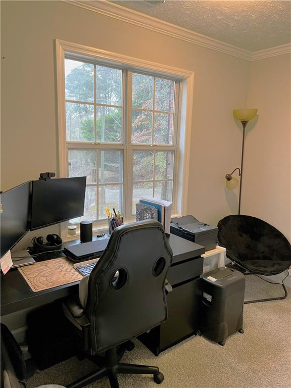 3735 Warwick Way Snellville, GA 30039 - Photo 16 of 28 a view of a workspace with furniture and a window