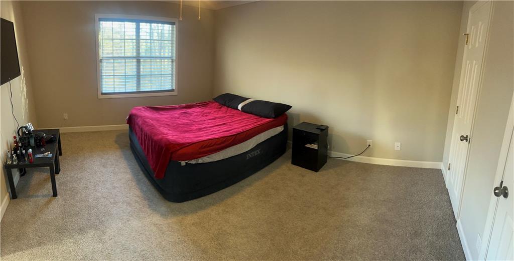 3735 Warwick Way Snellville, GA 30039 - Photo 17 of 28 a bedroom with a bed and window