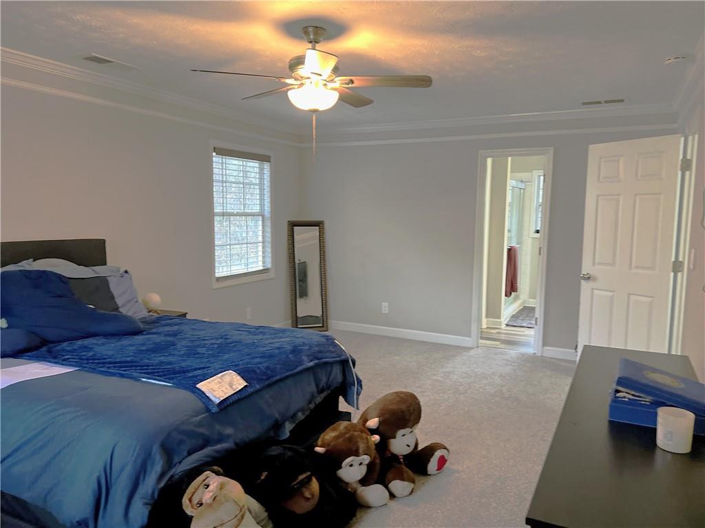 3735 Warwick Way Snellville, GA 30039 - Photo 19 of 28 a bedroom with bed and window