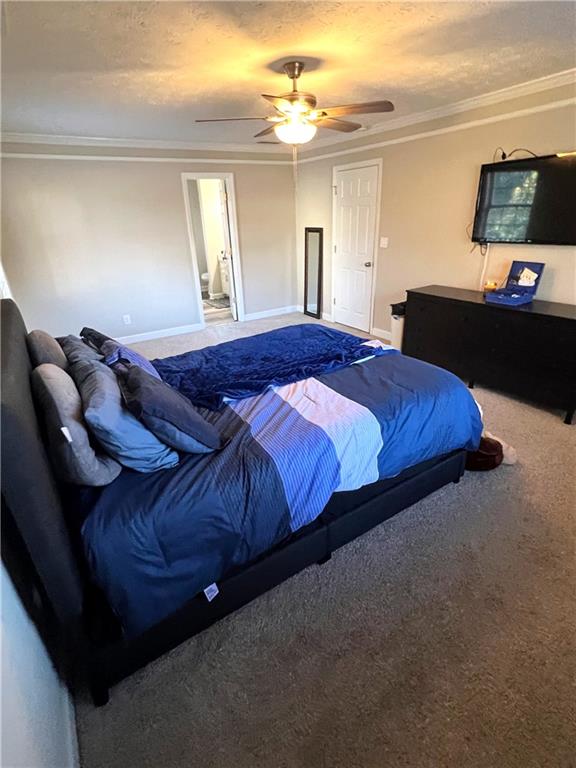 3735 Warwick Way Snellville, GA 30039 - Photo 20 of 28 a spacious bedroom with a bed and a flat screen tv