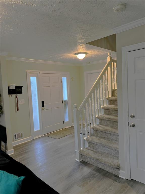 3735 Warwick Way Snellville, GA 30039 - Photo 2 of 28 a view of entryway and hall with wooden floor