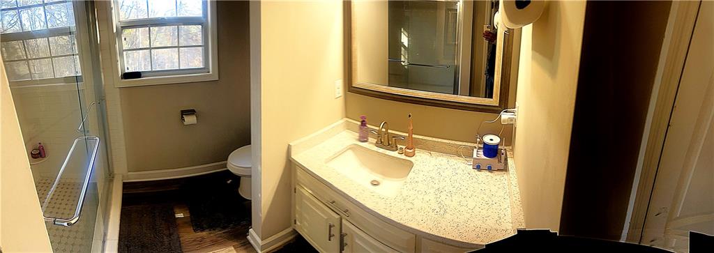 3735 Warwick Way Snellville, GA 30039 - Photo 21 of 28 a bathroom with a sink and a mirror