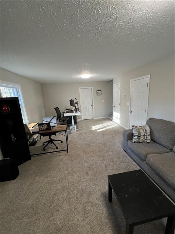 3735 Warwick Way Snellville, GA 30039 - Photo 24 of 28 a living room with furniture and a lamp