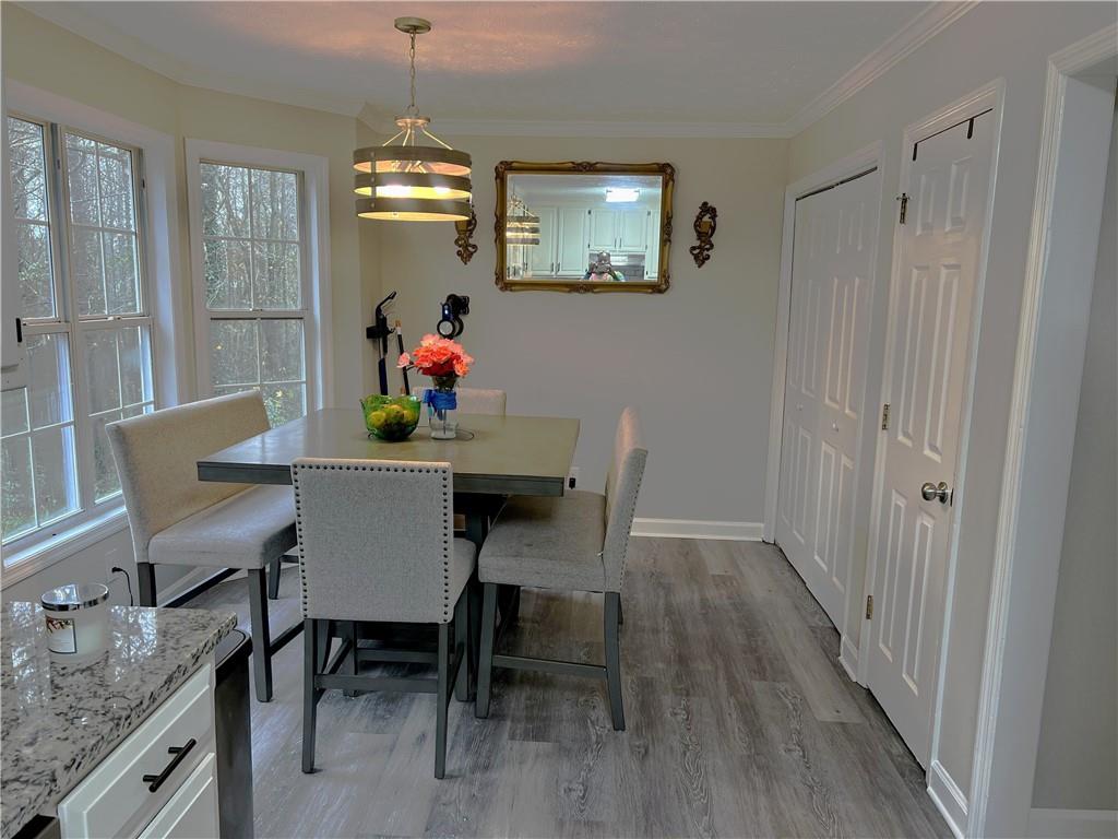 3735 Warwick Way Snellville, GA 30039 - Photo 9 of 28 a view of a dining room with furniture window and wooden floor