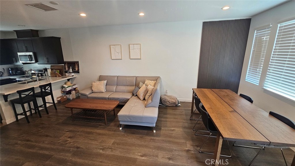 8073 Ackerman Street Buena Park, CA 90621 - Photo 14 of 43 a living room with furniture and a flat screen tv