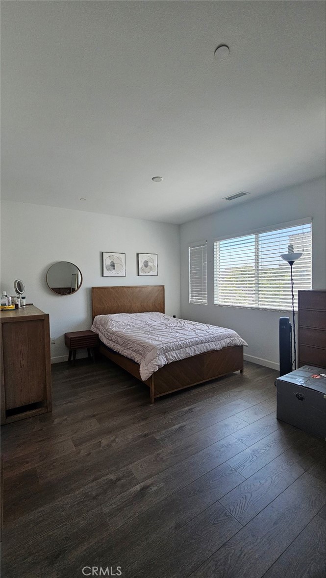 8073 Ackerman Street Buena Park, CA 90621 - Photo 19 of 43 a bedroom with a bed and a large window