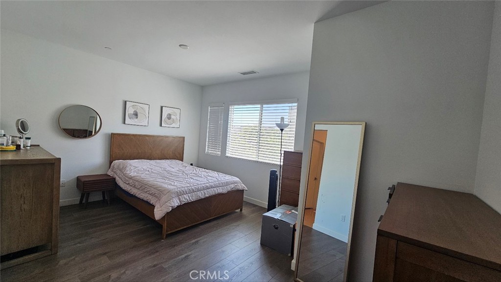 8073 Ackerman Street Buena Park, CA 90621 - Photo 20 of 43 a bedroom with a bed and a chair in it