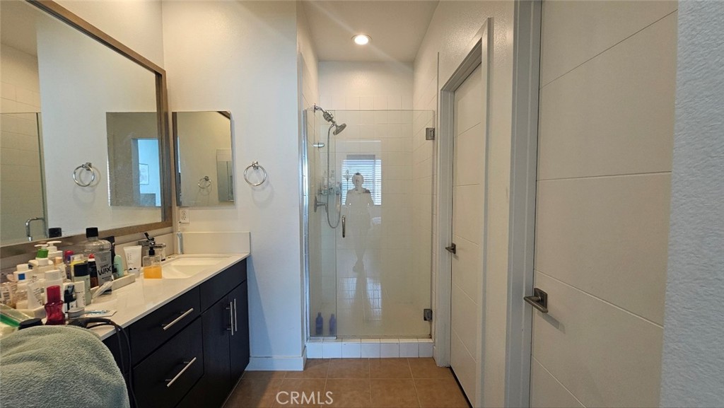 8073 Ackerman Street Buena Park, CA 90621 - Photo 21 of 43 a bathroom with a double vanity sink a toilet and shower