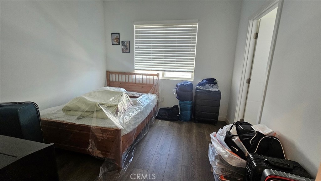 8073 Ackerman Street Buena Park, CA 90621 - Photo 23 of 43 a bedroom with a bed and a window