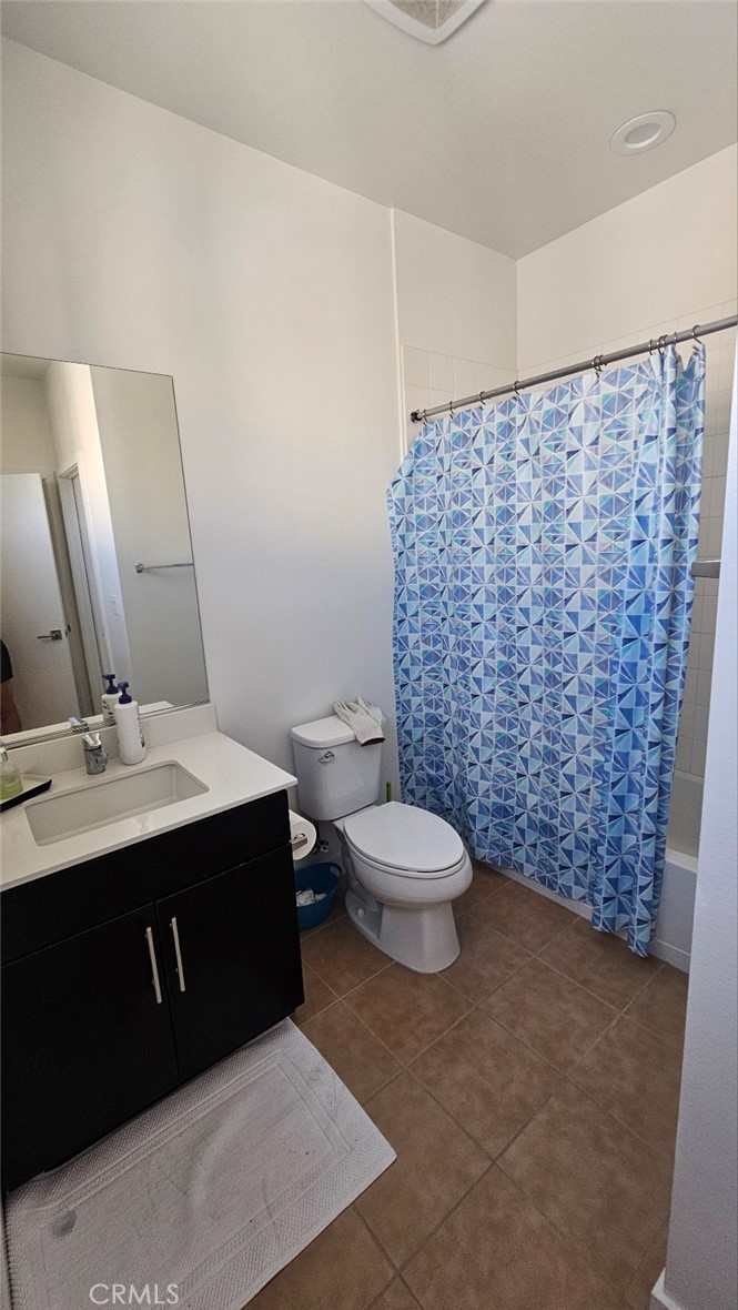 8073 Ackerman Street Buena Park, CA 90621 - Photo 25 of 43 a bathroom with a sink and a mirror