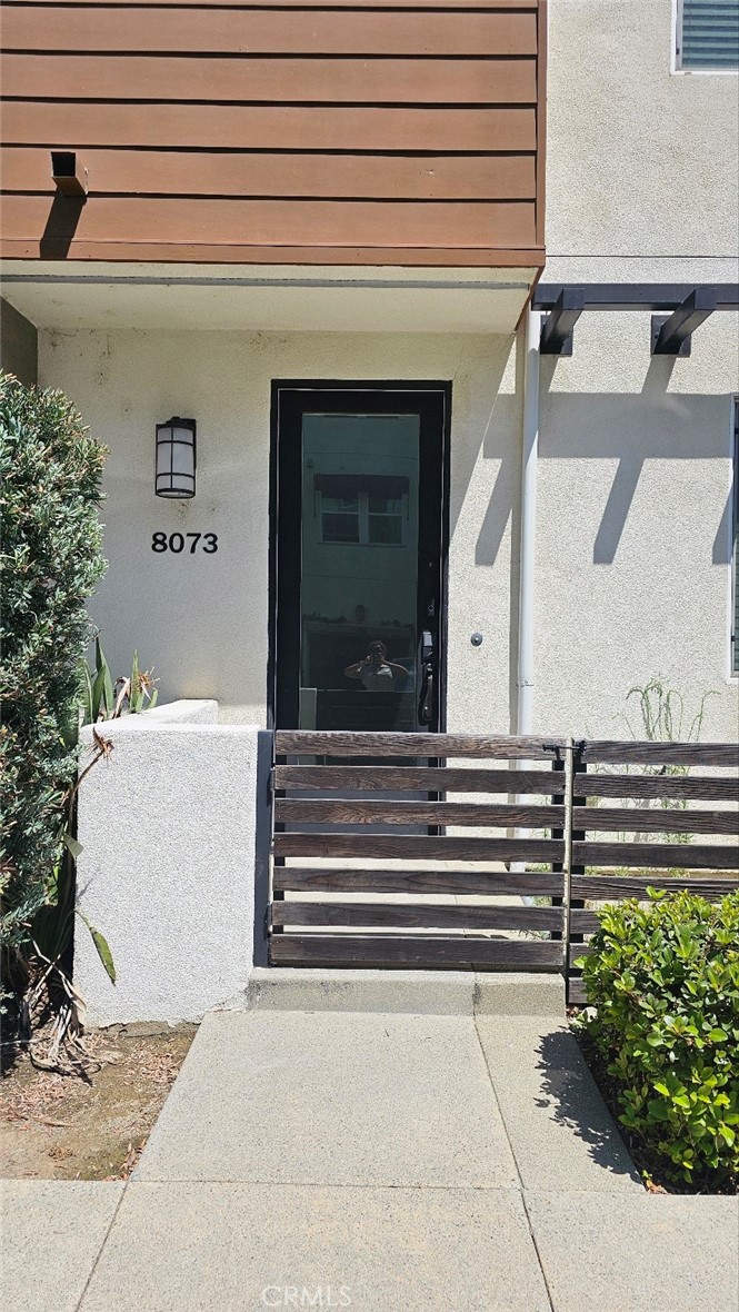8073 Ackerman Street Buena Park, CA 90621 - Photo 30 of 43 a front view of a house with a garden
