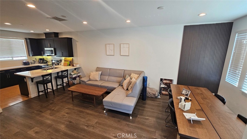 8073 Ackerman Street Buena Park, CA 90621 - Photo 6 of 43 a living room with furniture and a wooden floor