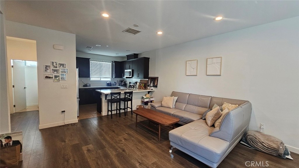 8073 Ackerman Street Buena Park, CA 90621 - Photo 7 of 43 a living room with furniture and a table