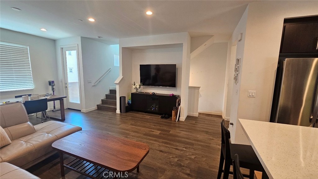 8073 Ackerman Street Buena Park, CA 90621 - Photo 8 of 43 a living room with furniture and a flat screen tv