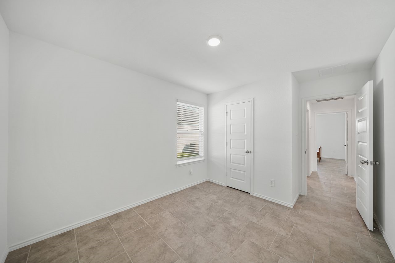 7502 Fierce Friesian Lane Rosharon, TX 77583 - Photo 12 of 21 a view of a big room with closet and windows