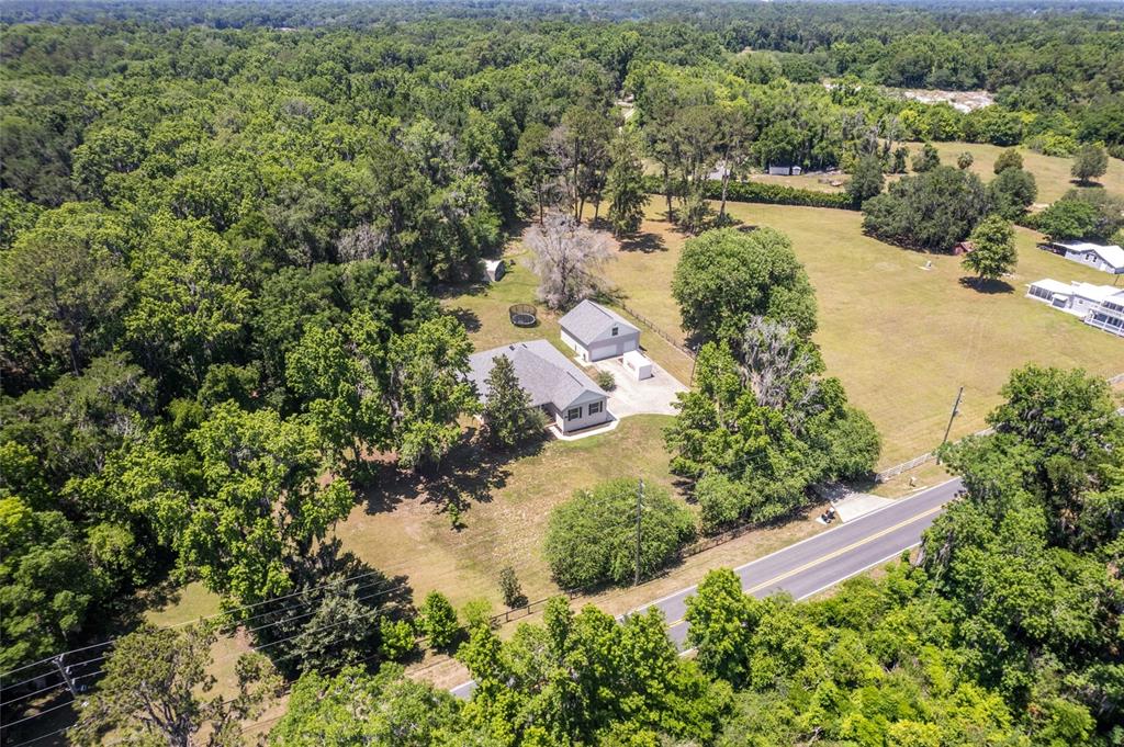 4735 Southeast 112th Street Road Belleview, FL 34420 - Photo 10 of 73 an aerial view of residential house with outdoor space and swimming pool
