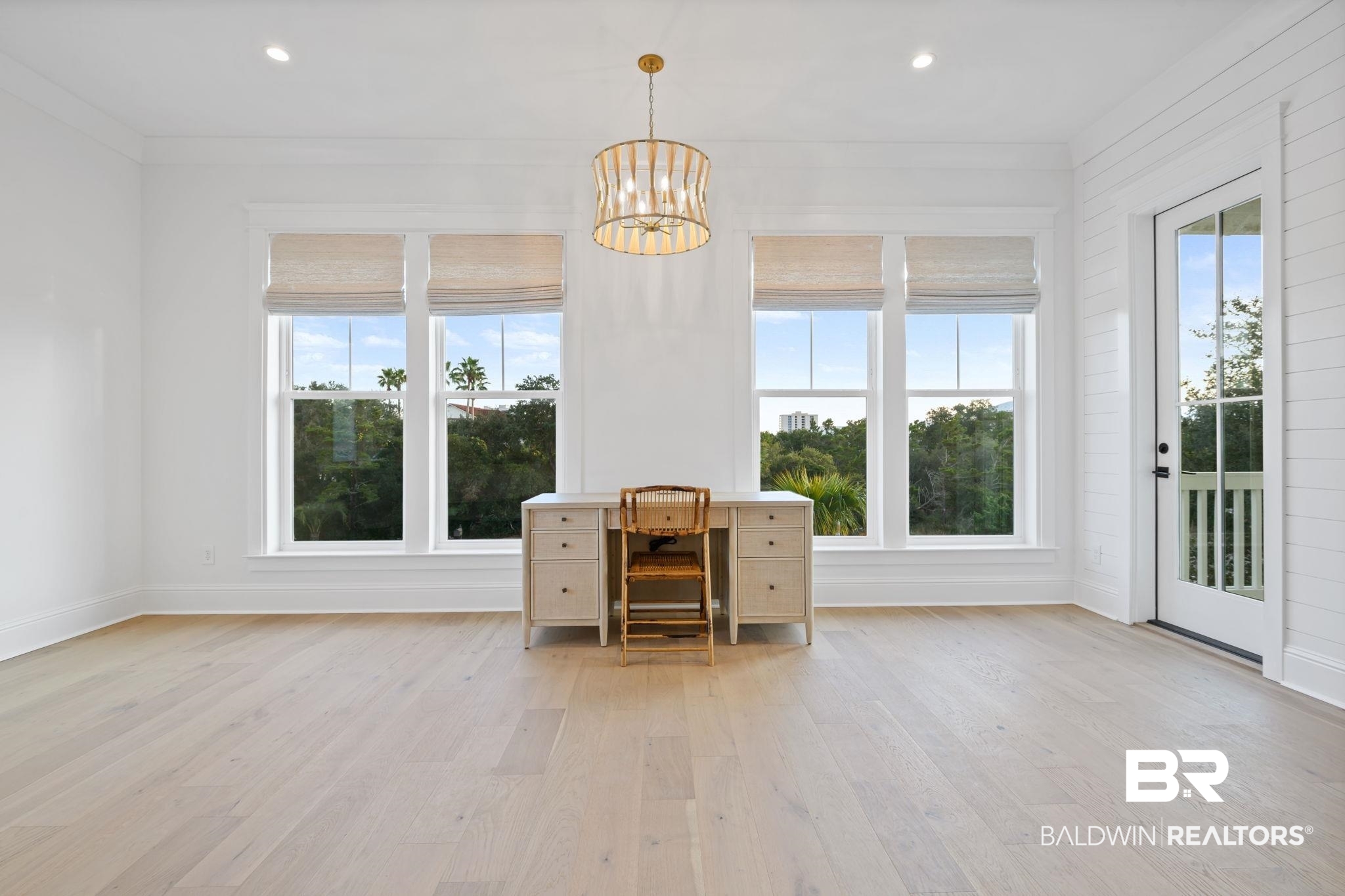30313 River Road Orange Beach, AL 36561 - Photo 42 of 50 Unfurnished dining area featuring light wood-type flooring, a chandelier, recessed lighting, and crown molding