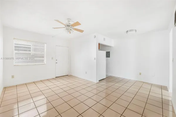 a view of an empty room and window