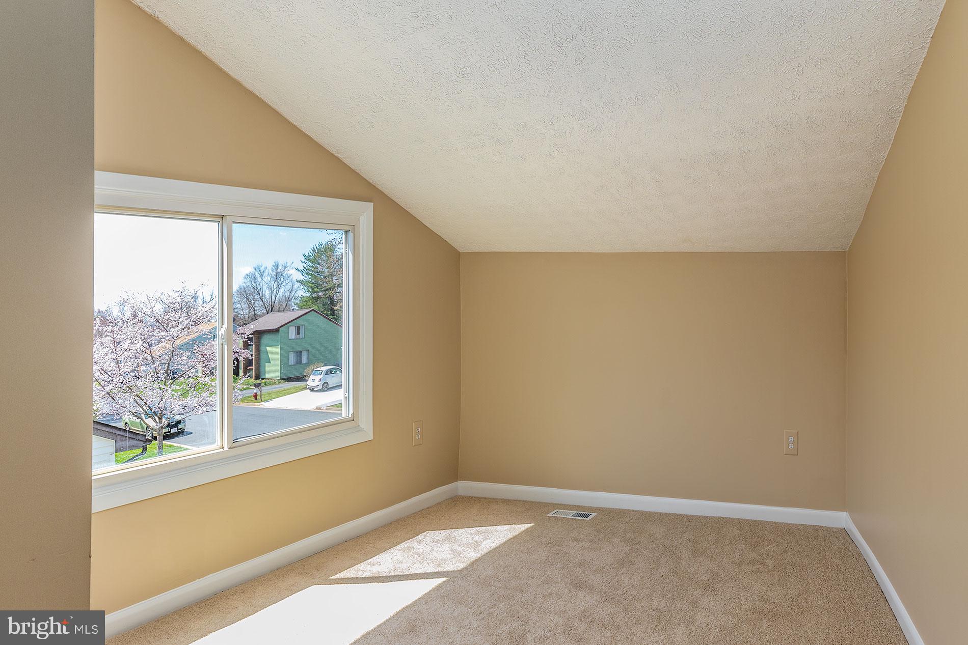 114 South Fox Road Sterling, VA 20164 - Photo 22 of 30 UPSTAIRS WITH SLOPE CEILING IN BEDROOM
