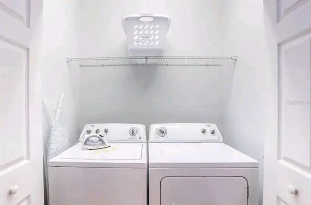 a utility room with dryer and washer