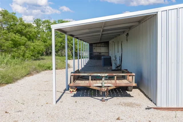 a view of backyard with cabin