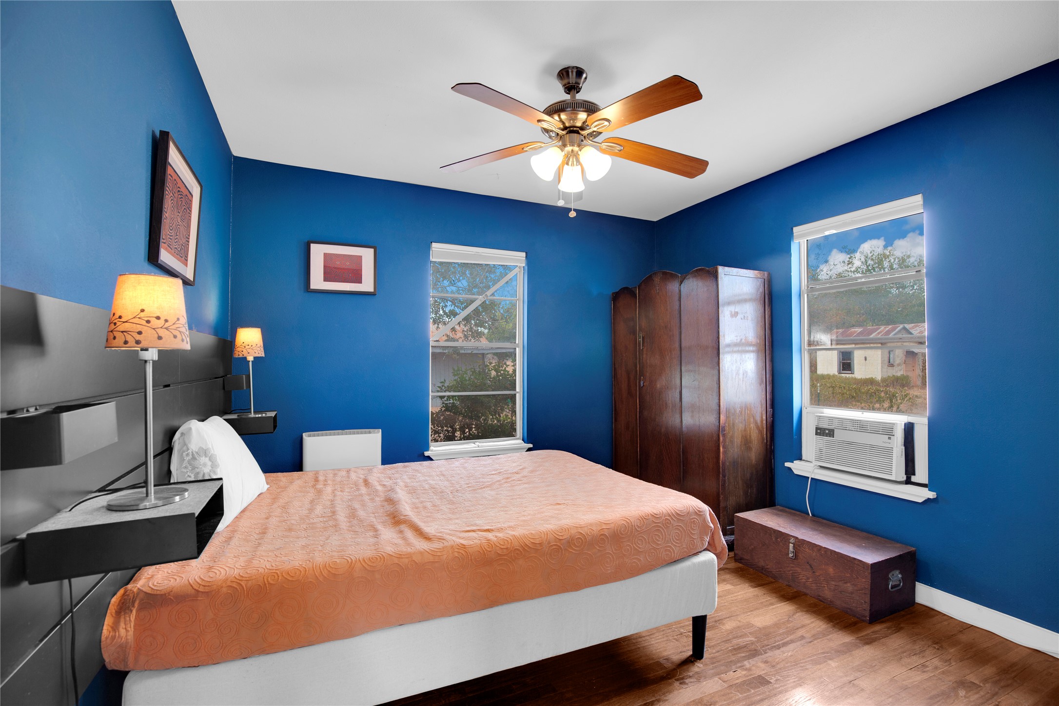 1607 East 4th Street Taylor, TX 76574 - Photo 18 of 32 Bedroom featuring wood finished floors and ceiling fan