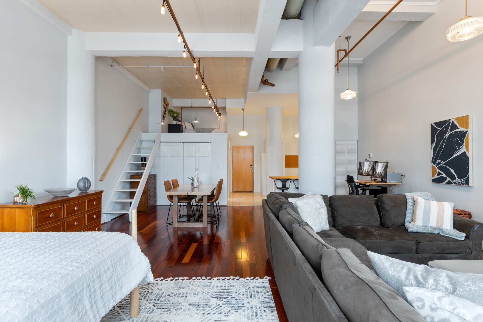 801 South Wells Street, Unit 1006 Chicago, IL 60607 - Photo 12 of 25 a view of living room with furniture and wooden floor