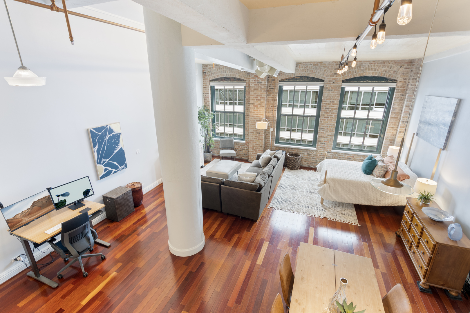 801 South Wells Street, Unit 1006 Chicago, IL 60607 - Photo 18 of 25 a living room with furniture and wooden floor