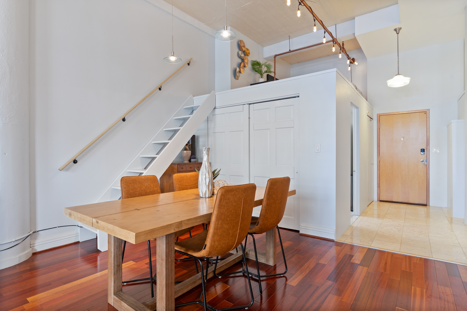 801 South Wells Street, Unit 1006 Chicago, IL 60607 - Photo 9 of 25 a dining room with furniture and wooden floor