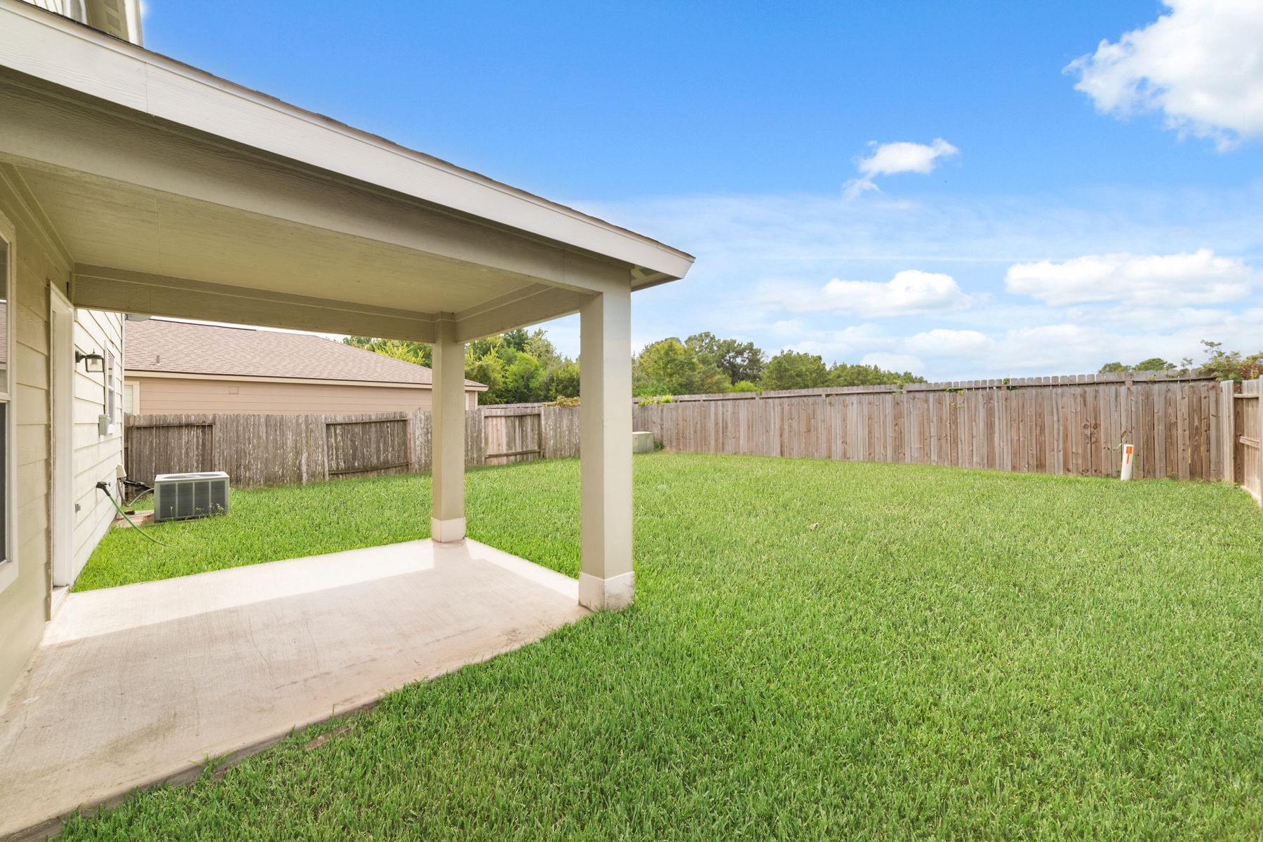 21311 Shadow River Lane Spring, TX 77379 - Photo 11 of 38 Covered back patio. The old AC in the photo has been replaced!
