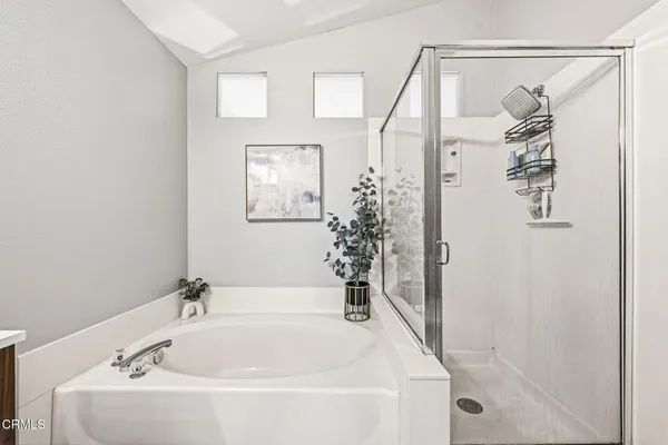 a bathroom with a bathtub and shower