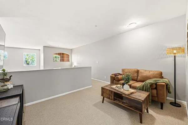 a living room with furniture and a couch