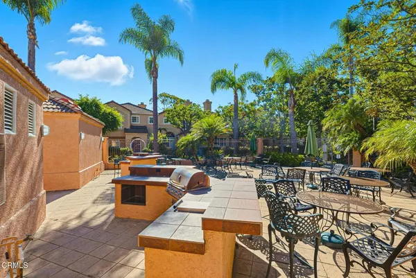 a view of a patio with swimming pool
