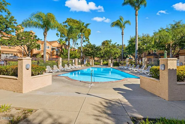 a view of a swimming pool with a patio