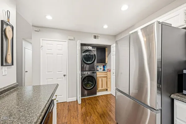 a view of a kitchen with refrigerator and washer