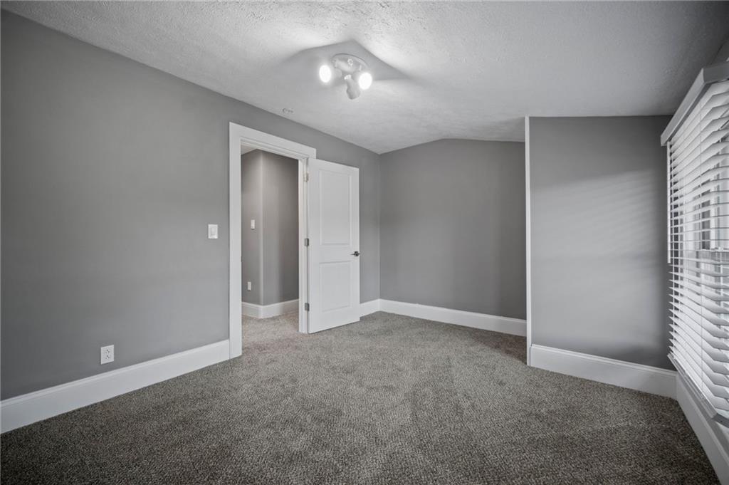 736 Shenango Road New Castle, PA 16101 - Photo 18 of 41 an empty room with closet and a chandelier fan